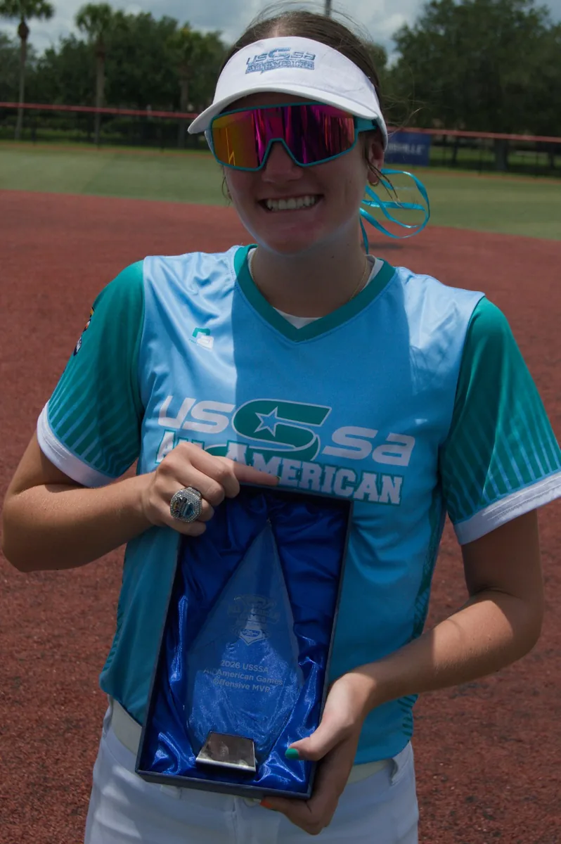 Hailey holding her 2026 USSSA All-American Games Offensive MVP trophy